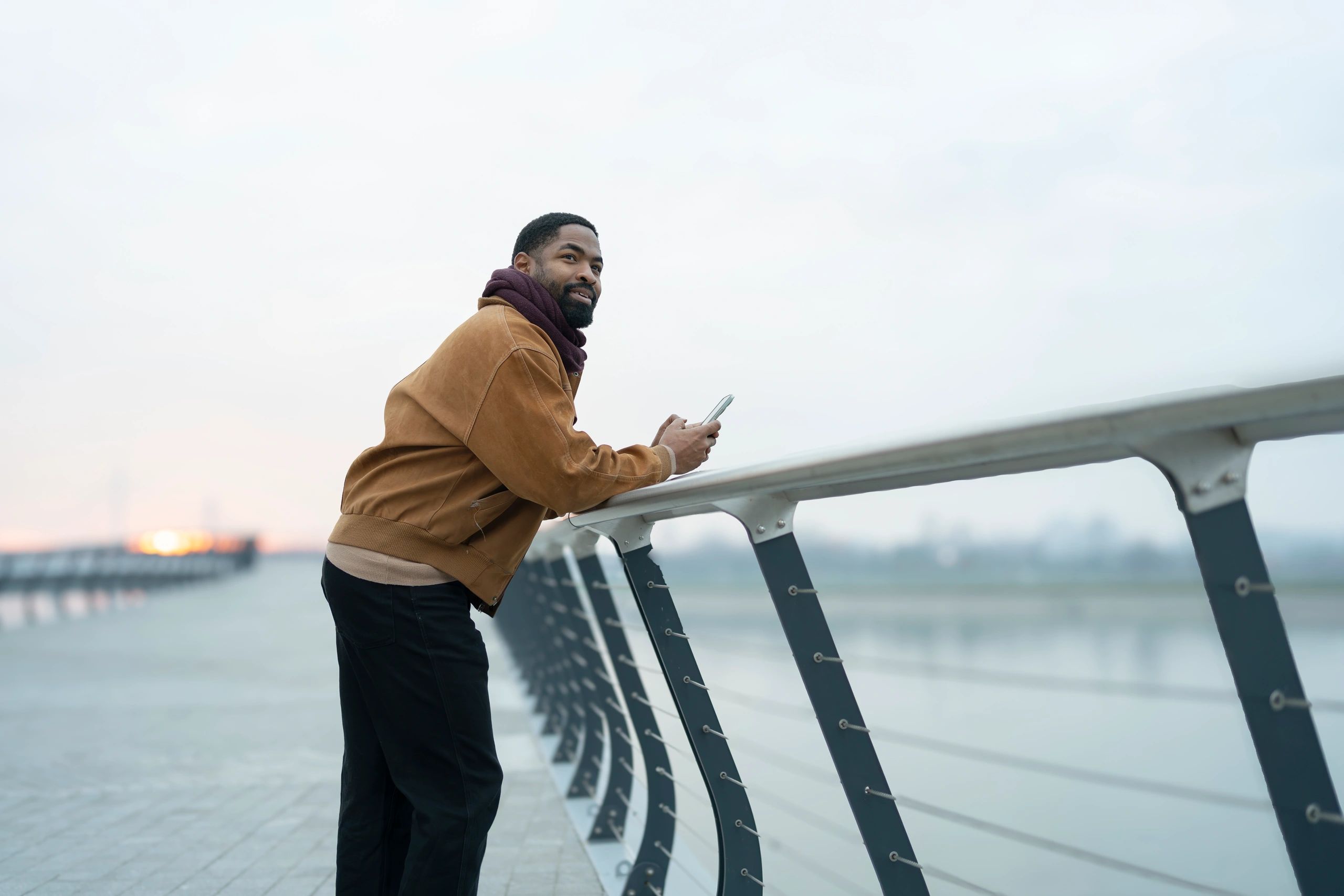 Man reflecting quietly while looking over a city view